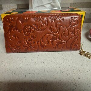 Brown tooled wallet with charm